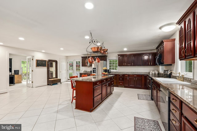 10200 Souza Ln, Manassas, VA 20111 - kitchen featuring a sink, stainless steel appliances, a kitchen island, dark stone counters, and recessed lighting