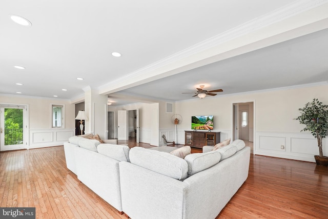 10200 Souza Ln, Manassas, VA 20111 - living room featuring a decorative wall, light wood-style floors, ornamental molding, wainscoting, and recessed lighting