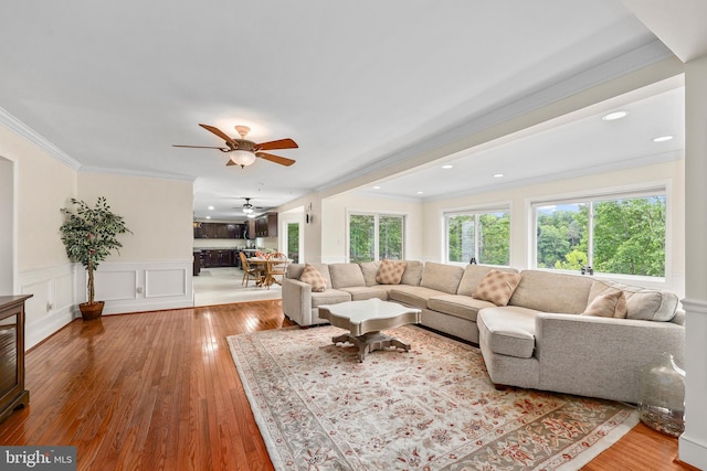 10200 Souza Ln, Manassas, VA 20111 - living room with a ceiling fan, crown molding, wood-type flooring, a wainscoted wall, and recessed lighting