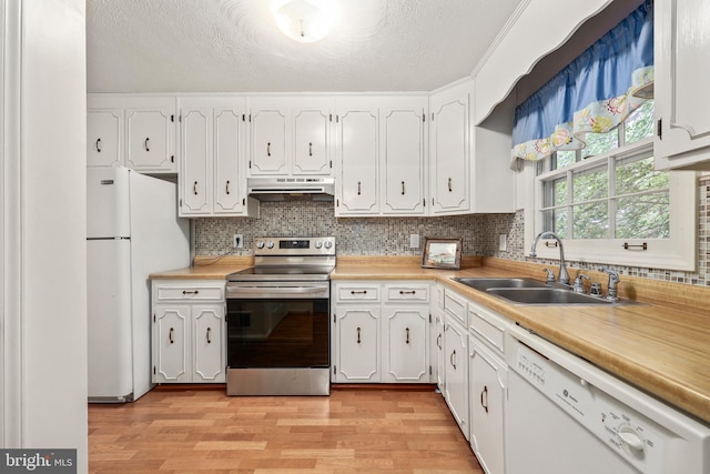 10200 Souza Ln, Manassas, VA 20111 - kitchen with white appliances, a sink, under cabinet range hood, white cabinets, and light wood-style flooring