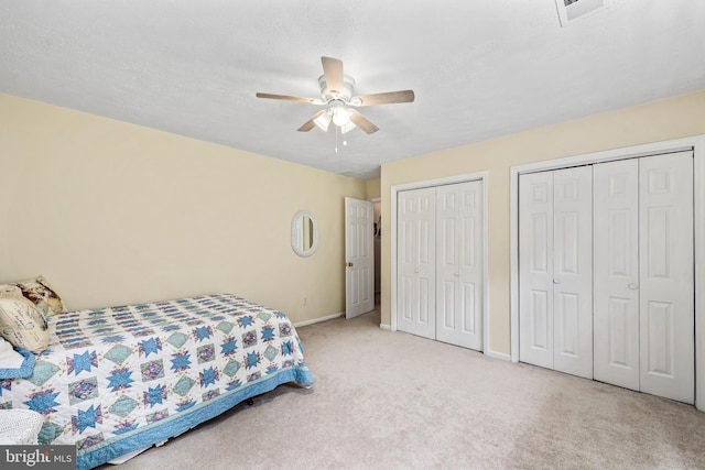 10200 Souza Ln, Manassas, VA 20111 - bedroom with two closets, carpet, baseboards, and ceiling fan