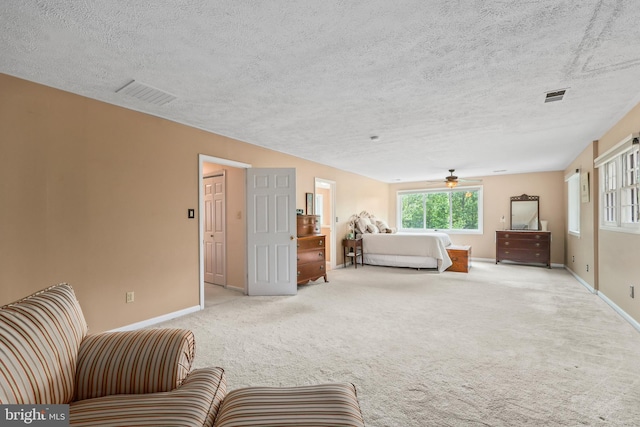 10200 Souza Ln, Manassas, VA 20111 - living area featuring carpet, baseboards, ceiling fan, and a textured ceiling