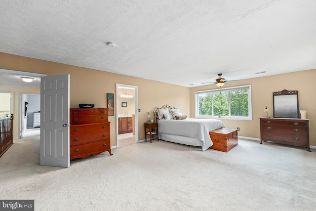 10200 Souza Ln, Manassas, VA 20111 - bedroom featuring carpet, baseboards, a textured ceiling, connected bathroom, and a ceiling fan