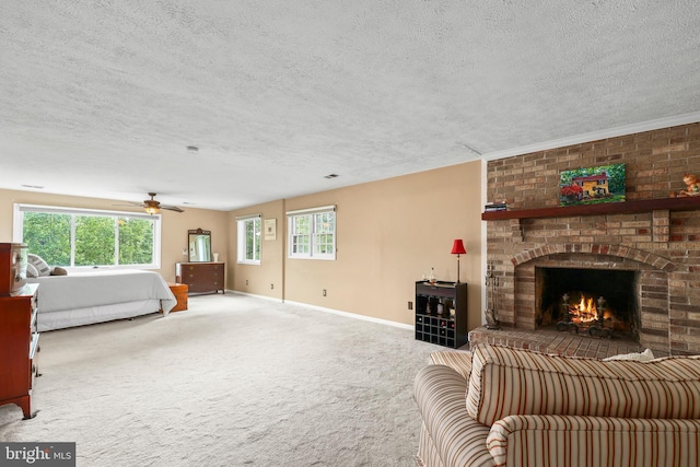 10200 Souza Ln, Manassas, VA 20111 - carpeted living room with a fireplace, ceiling fan, a textured ceiling, and baseboards