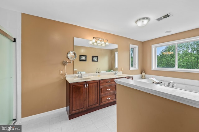 10200 Souza Ln, Manassas, VA 20111 - bathroom with double vanity, a garden tub, a shower with door, tile patterned flooring, and baseboards