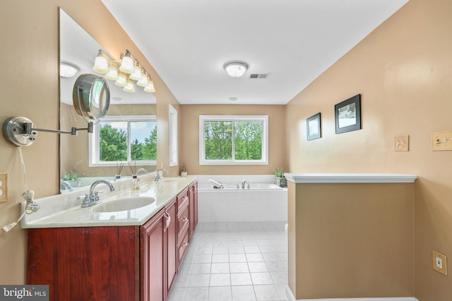 10200 Souza Ln, Manassas, VA 20111 - bathroom with double vanity, a garden tub, and tile patterned floors
