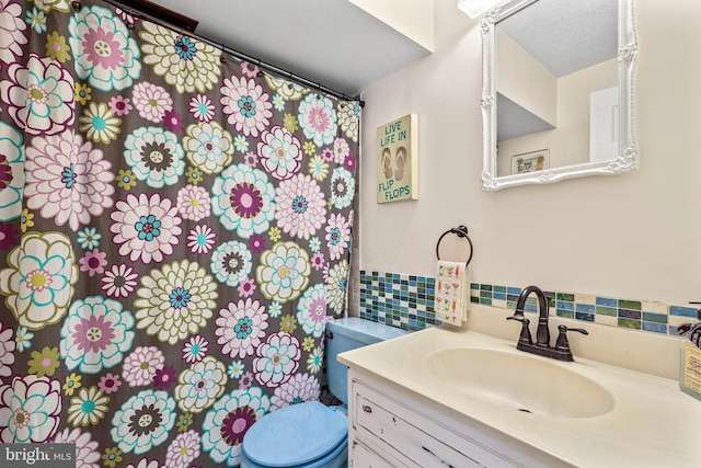 10200 Souza Ln, Manassas, VA 20111 - bathroom featuring toilet, vanity, decorative backsplash, and a shower with shower curtain