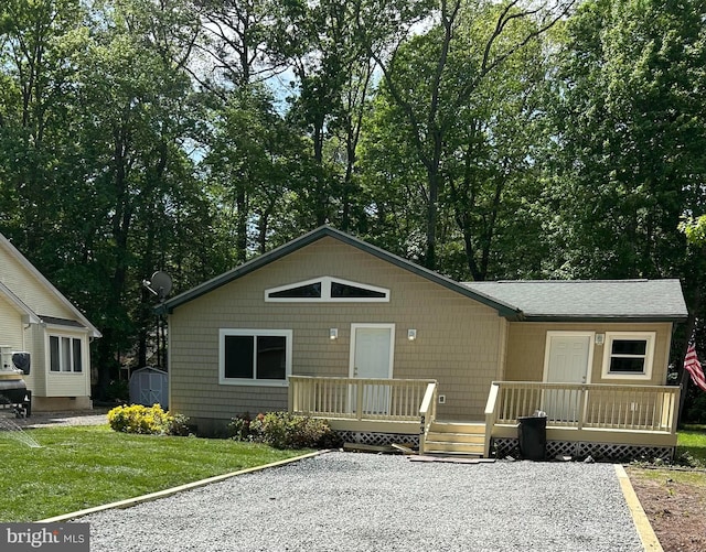 23 Beaconhill Rd, Ocean Pines, MD 21811 - view of front of property with a front yard and a wooden deck