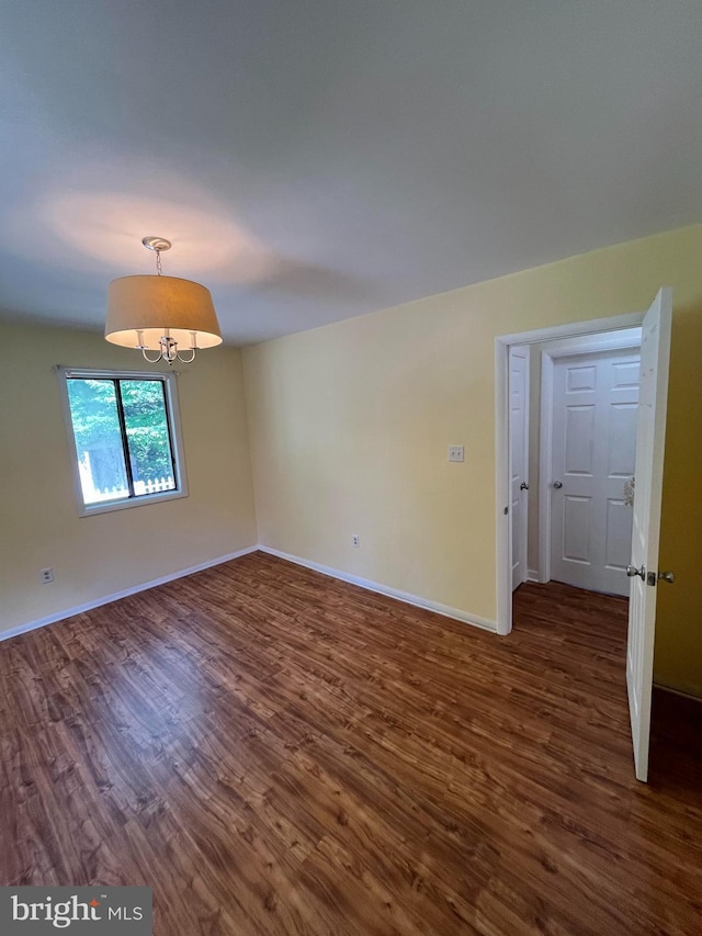 23 Beaconhill Rd, Ocean Pines, MD 21811 - empty room with dark wood-type flooring and baseboards
