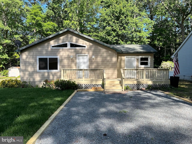 23 Beaconhill Rd, Ocean Pines, MD 21811 - view of front of property featuring a deck and a front lawn