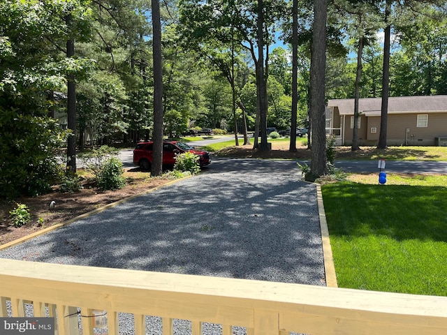 23 Beaconhill Rd, Ocean Pines, MD 21811 - view of asphalt road featuring view of scattered trees