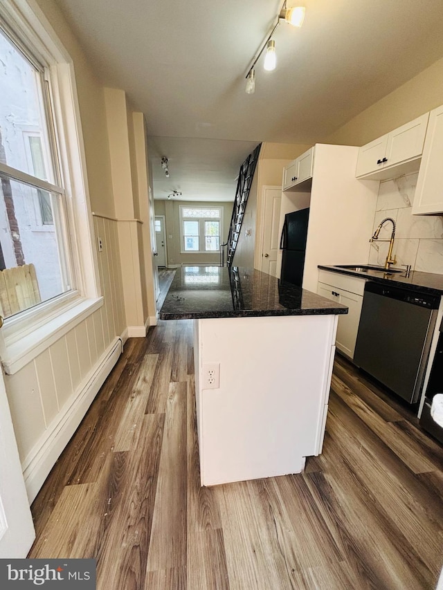 805 W Bristol St, Philadelphia, PA 19140 - kitchen featuring freestanding refrigerator, dishwasher, a sink, dark wood-style floors, and wainscoting