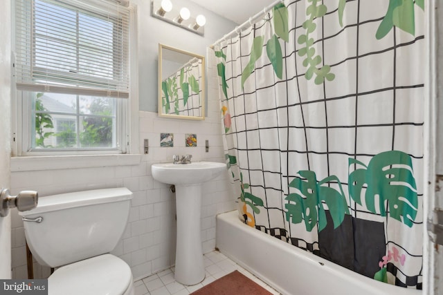 2029 Norhurst Way S, Baltimore, MD 21228 - full bathroom featuring tile walls, toilet, tile patterned flooring, shower / bath combo with shower curtain, and wainscoting