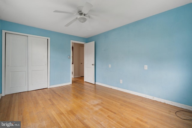 2029 Norhurst Way S, Baltimore, MD 21228 - unfurnished bedroom with a closet, baseboards, light wood-style floors, and a ceiling fan