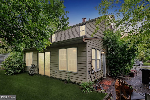 2029 Norhurst Way S, Baltimore, MD 21228 - view of home's exterior with a yard and a chimney