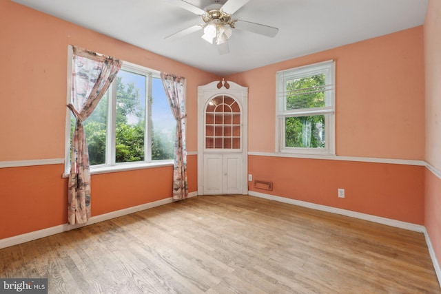 2029 Norhurst Way S, Baltimore, MD 21228 - spare room featuring plenty of natural light, baseboards, wood finished floors, and a ceiling fan