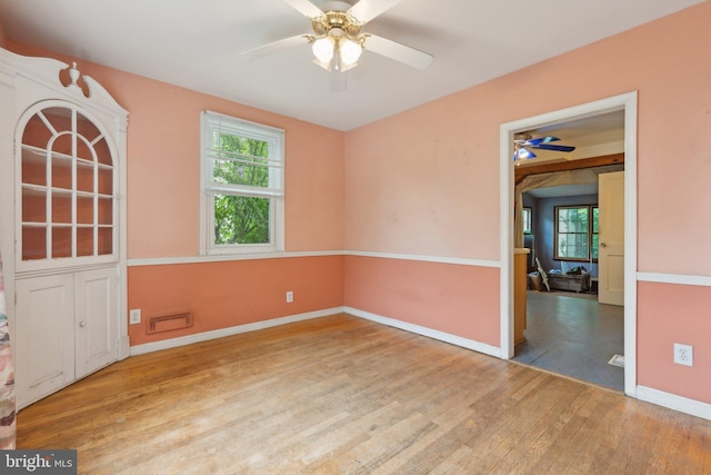 2029 Norhurst Way S, Baltimore, MD 21228 - unfurnished room featuring ceiling fan, wood finished floors, healthy amount of natural light, and baseboards