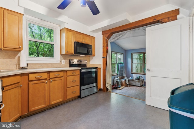 2029 Norhurst Way S, Baltimore, MD 21228 - kitchen with stainless steel electric range, black microwave, backsplash, lofted ceiling, and light countertops