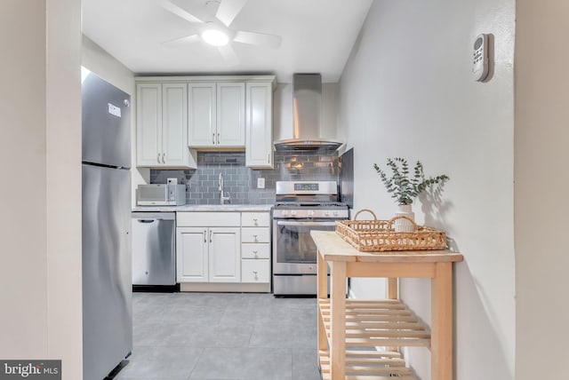 4201 Cathedral Ave NW Unit 918W, Washington, DC 20016 - kitchen featuring wall chimney exhaust hood, stainless steel appliances, tasteful backsplash, ceiling fan, and light countertops