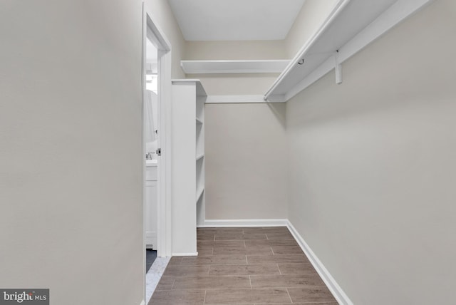 4201 Cathedral Ave NW Unit 918W, Washington, DC 20016 - walk in closet featuring wood tiled floors