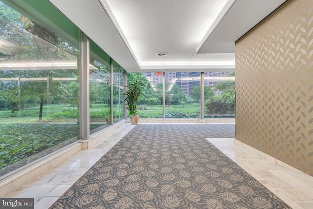 4201 Cathedral Ave NW Unit 918W, Washington, DC 20016 - unfurnished sunroom with floor to ceiling windows and a raised ceiling