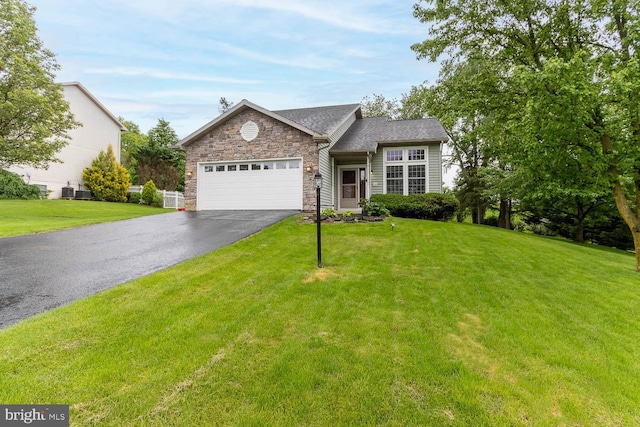 120 Jefferson Cir, Bellefonte, PA 16823 - view of front facade featuring driveway, a garage, stone siding, and a front yard