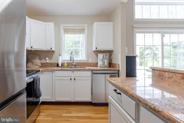 120 Jefferson Cir, Bellefonte, PA 16823 - kitchen featuring stainless steel appliances, a sink, white cabinets, and light wood-style floors