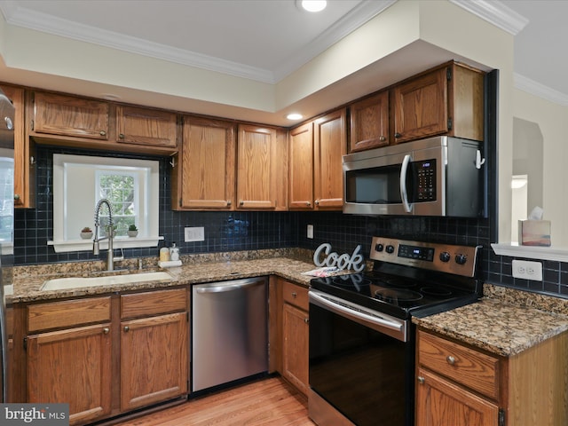 10612 Winfield Loop, Manassas, VA 20109 - kitchen featuring stainless steel appliances, a sink, ornamental molding, stone counters, and decorative backsplash