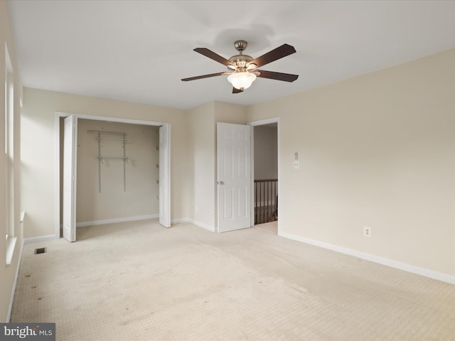 10612 Winfield Loop, Manassas, VA 20109 - unfurnished bedroom featuring a closet, light colored carpet, baseboards, and a ceiling fan