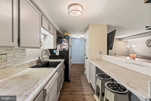 43 Cranberry Ct, Marlton, NJ 08053 - kitchen with a sink, dark wood-type flooring, decorative backsplash, light countertops, and a textured ceiling
