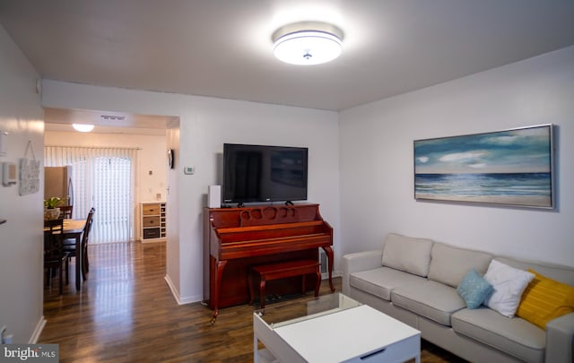 6408 Jefferson Pl, Glen Burnie, MD 21061 - living room with dark wood-style flooring and baseboards