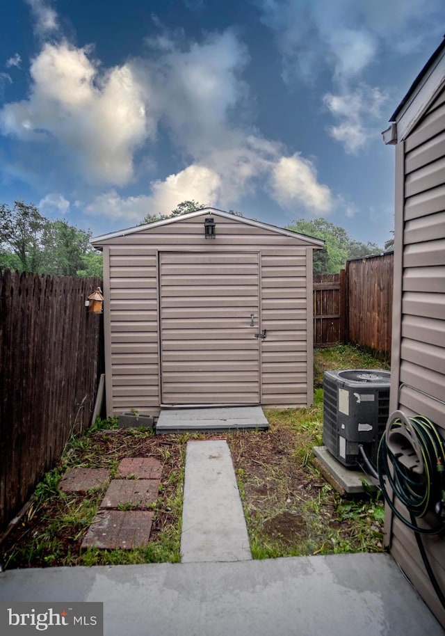 6408 Jefferson Pl, Glen Burnie, MD 21061 - view of shed featuring central air condition unit and a fenced backyard