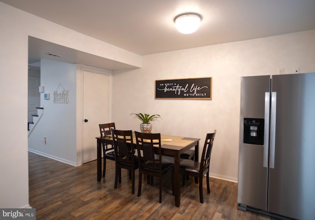 6408 Jefferson Pl, Glen Burnie, MD 21061 - dining area featuring baseboards, dark wood finished floors, and stairway