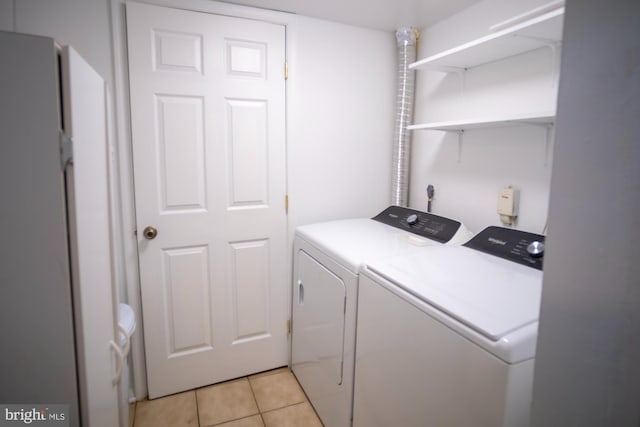 6408 Jefferson Pl, Glen Burnie, MD 21061 - laundry room featuring washing machine and clothes dryer and light tile patterned floors