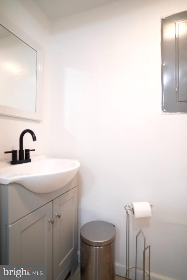 6408 Jefferson Pl, Glen Burnie, MD 21061 - half bath with electric panel, vanity, toilet, and baseboards