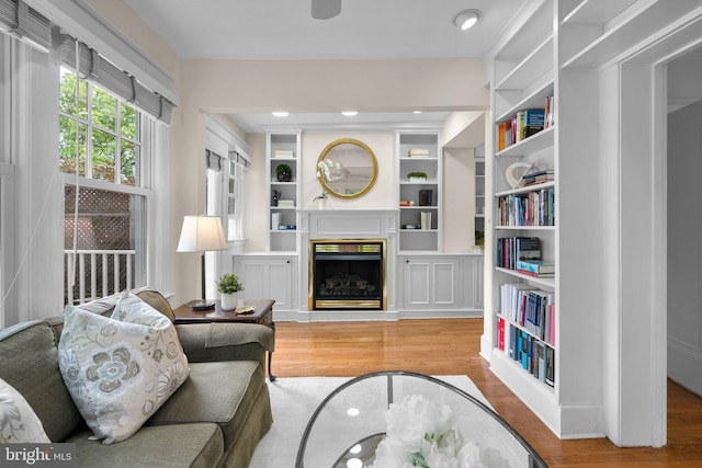 1937 38th St NW, Washington, DC 20007 - living room with wood finished floors, a fireplace, and built in shelves