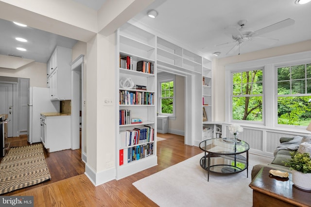 1937 38th St NW, Washington, DC 20007 - sitting room featuring ceiling fan, plenty of natural light, built in shelves, wood finished floors, and recessed lighting