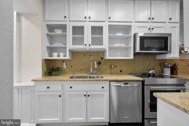 1937 38th St NW, Washington, DC 20007 - kitchen featuring stainless steel appliances, open shelves, and white cabinetry
