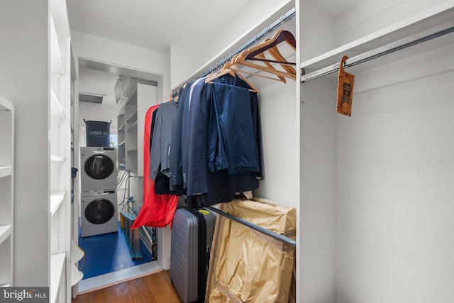 1937 38th St NW, Washington, DC 20007 - walk in closet with stacked washer / drying machine and wood finished floors
