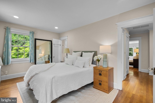 1937 38th St NW, Washington, DC 20007 - bedroom with light wood finished floors, multiple windows, and recessed lighting
