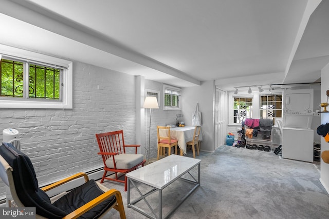 1937 38th St NW, Washington, DC 20007 - living room featuring brick wall, track lighting, and carpet