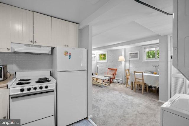 1937 38th St NW, Washington, DC 20007 - kitchen with white appliances, under cabinet range hood, light colored carpet, tasteful backsplash, and white cabinets