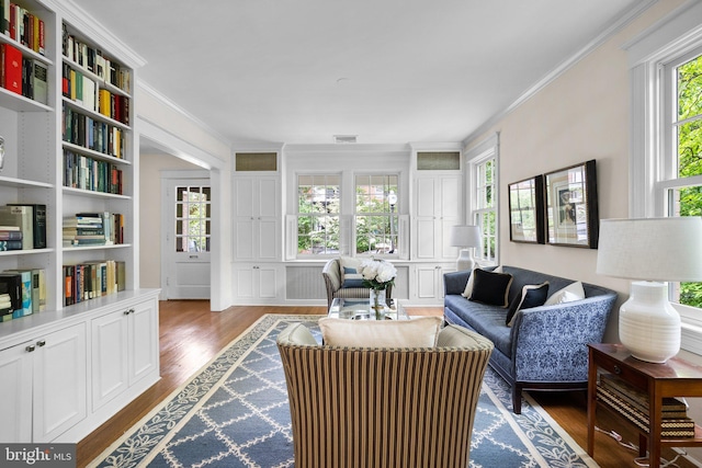 1937 38th St NW, Washington, DC 20007 - living room featuring ornamental molding, plenty of natural light, and dark wood-style floors