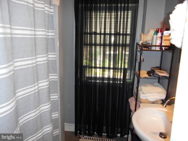 3210 Massachusetts Ave, Baltimore, MD 21229 - bathroom with a sink and a shower with shower curtain