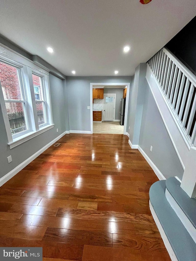2712 N 6th St, Harrisburg, PA 17110 - unfurnished living room featuring wood finished floors, stairway, recessed lighting, and baseboards