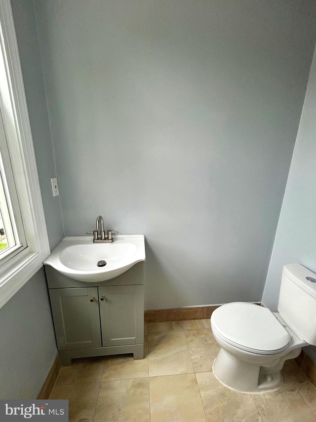 2712 N 6th St, Harrisburg, PA 17110 - half bathroom featuring toilet, vanity, and baseboards