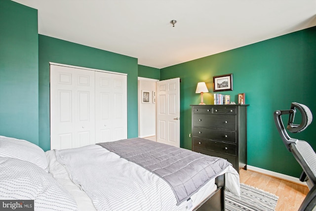 1312 Massachusetts Ave NW Unit 604, Washington, DC 20005 - bedroom featuring wood finished floors, a closet, and baseboards