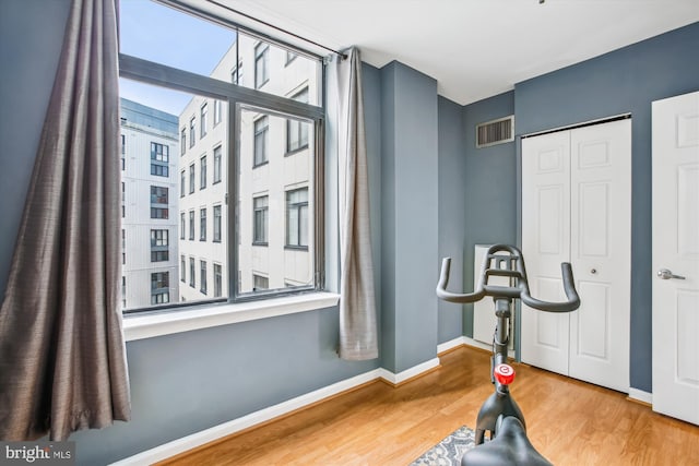 1312 Massachusetts Ave NW Unit 604, Washington, DC 20005 - workout area featuring wood finished floors and baseboards