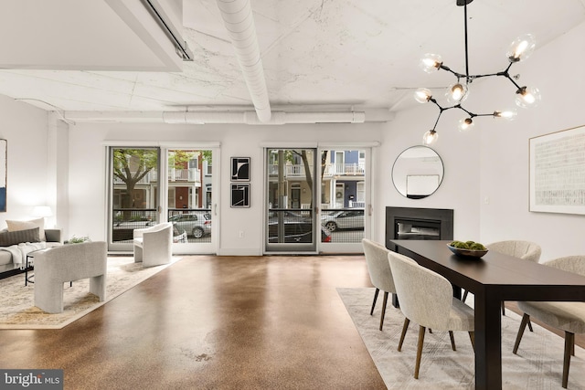 1700 Kalorama Rd NW Unit 206, Washington, DC 20009 - dining area with healthy amount of natural light, a glass covered fireplace, and a chandelier