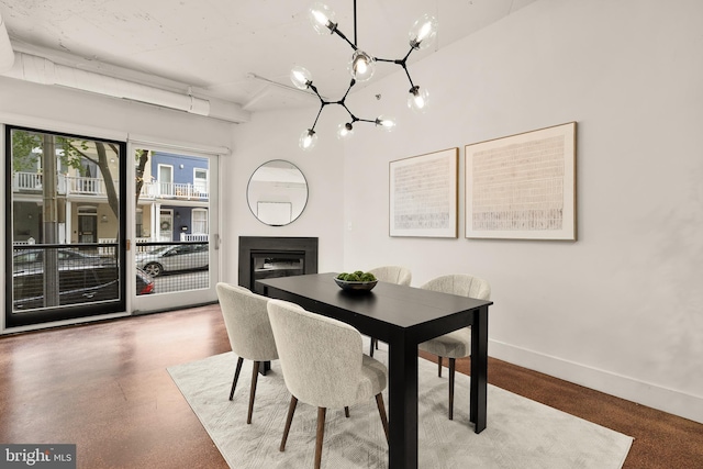 1700 Kalorama Rd NW Unit 206, Washington, DC 20009 - dining room with a chandelier, a fireplace, and baseboards